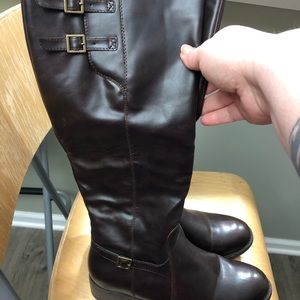 Tall brown boots with buckle details. Size 7